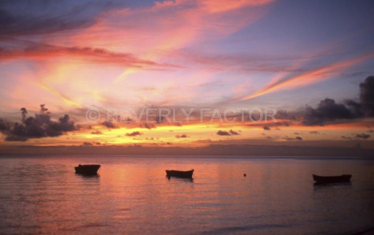 Sunset Island;colorful;yellow;sunset;sky;water;boat;pink;sillouettes;boat;Fiji